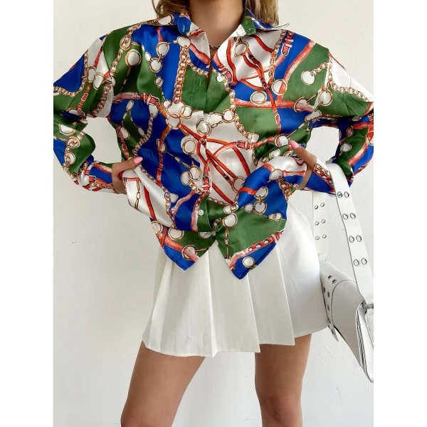 women's silk shirt printed with a pattern of colors, shapes and chains